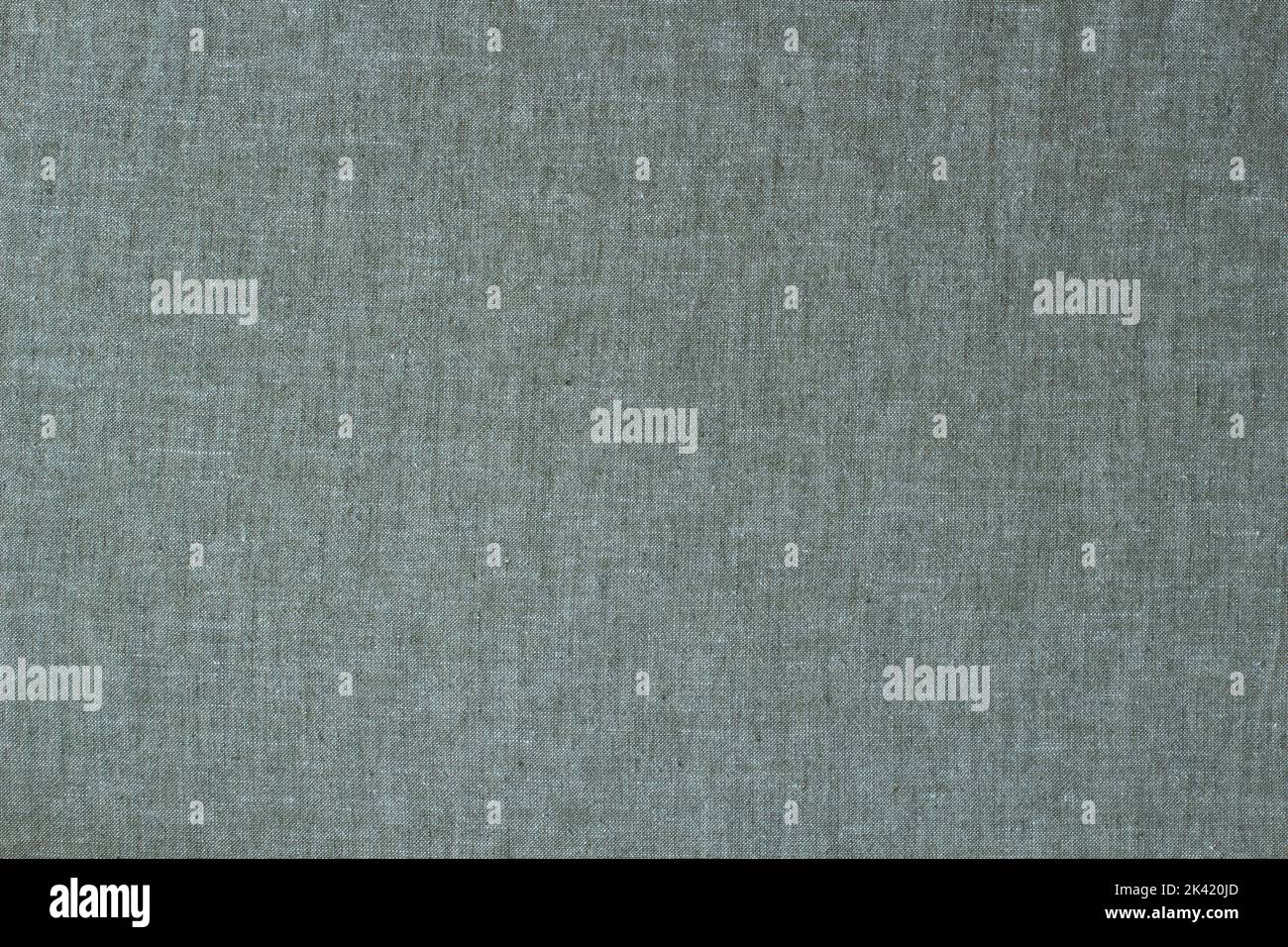 Natürlicher Leinenhintergrund. Grau, hellgrün gefärbte Leinen Bio-Textilien Leinwand Hintergrund. Draufsicht Stockfoto