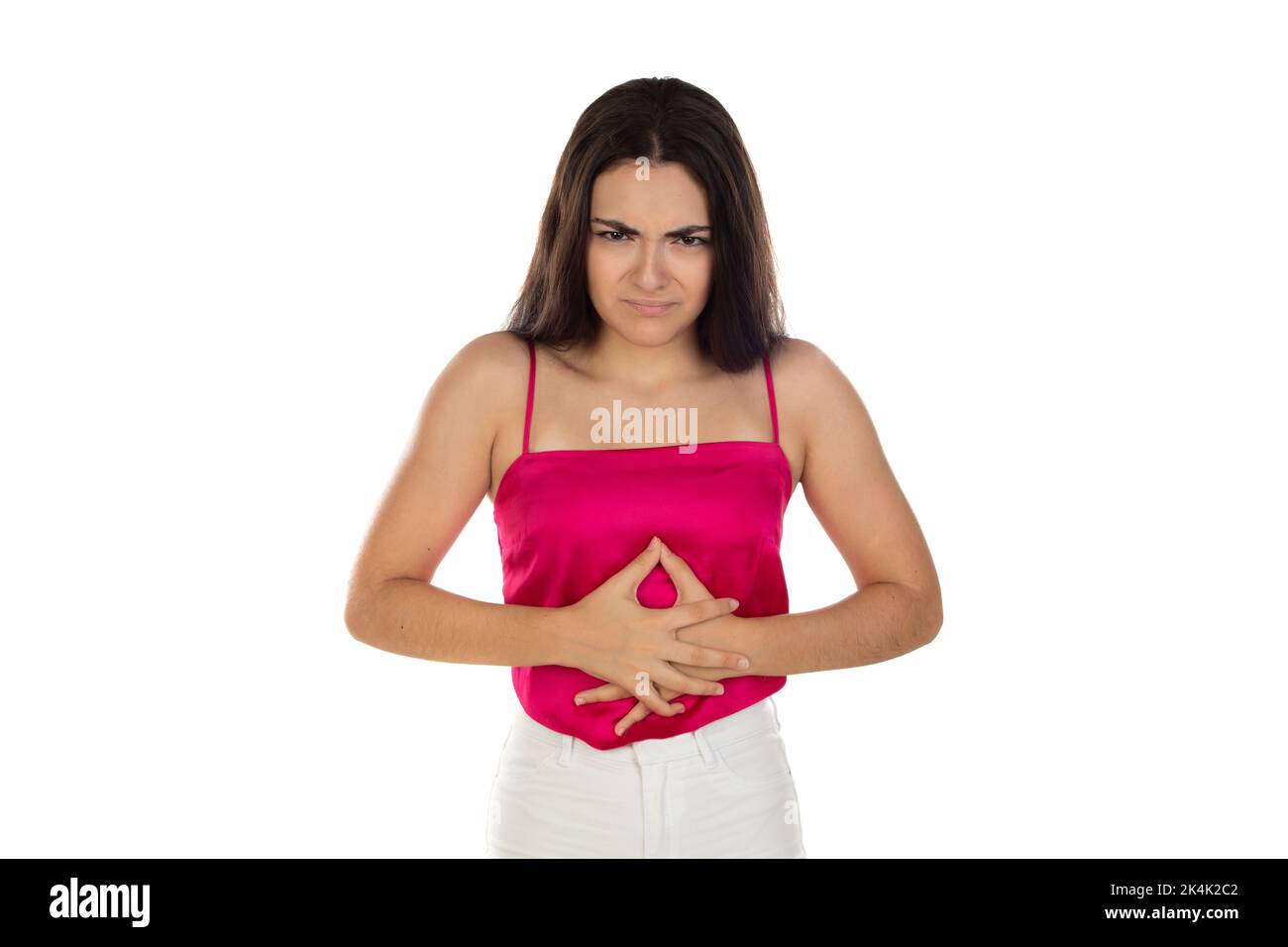 Gesundheitsproblem und Menschen Konzept - Teenager-Mädchen mit Bauchschmerzen auf weißem Hintergrund Stockfoto