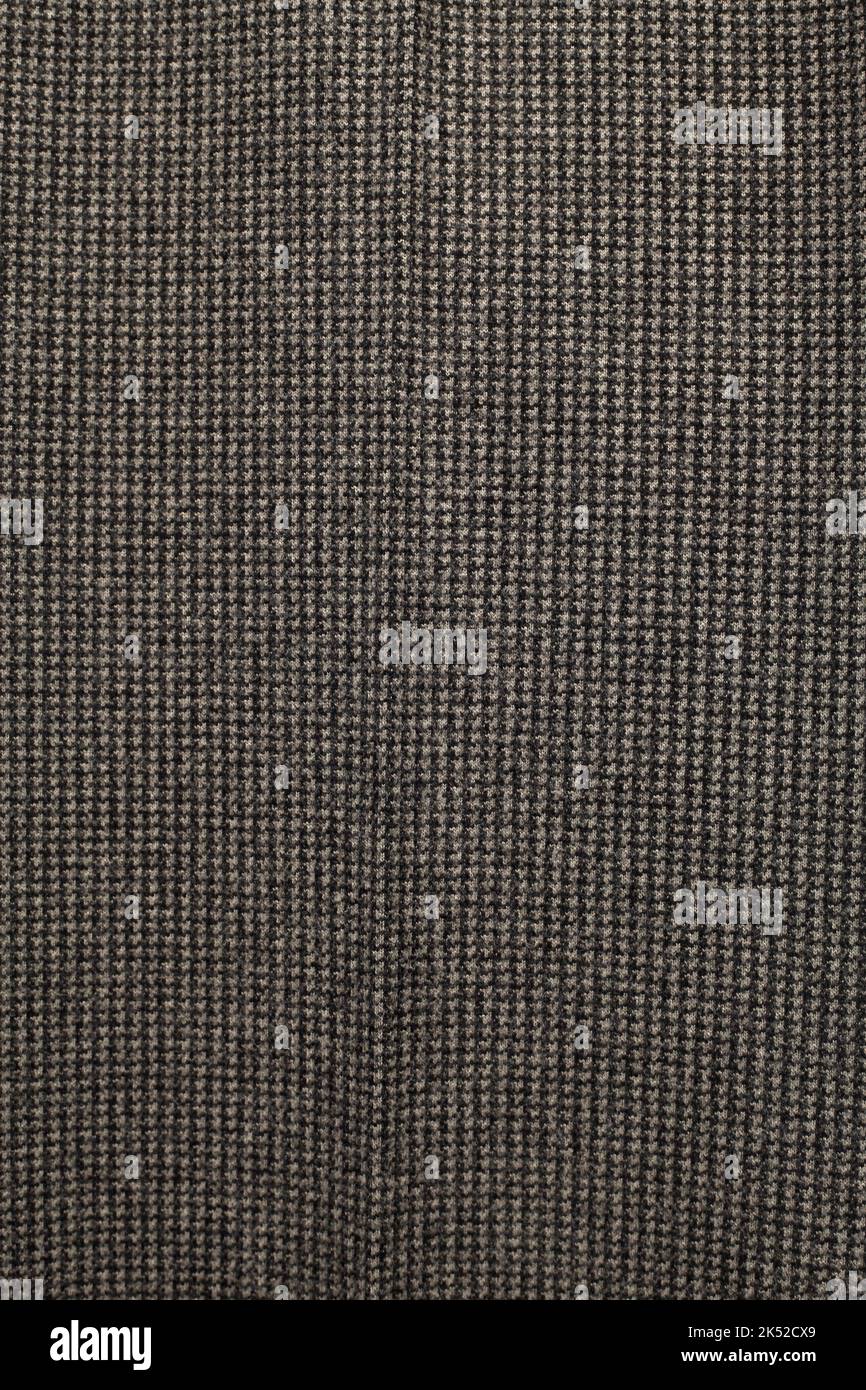 Nahtloses Stück Textil. Die Textur des Stoffes ist dunkelgrau. Stockfoto