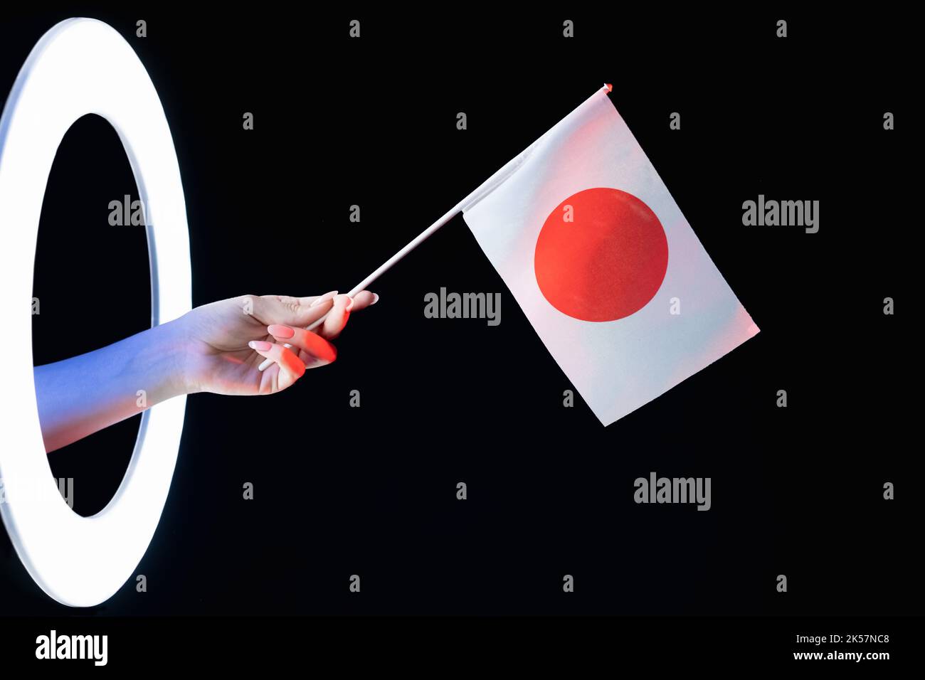 japan Flagge asiatische Kultur Hand nationales Symbol dunkel Stockfoto