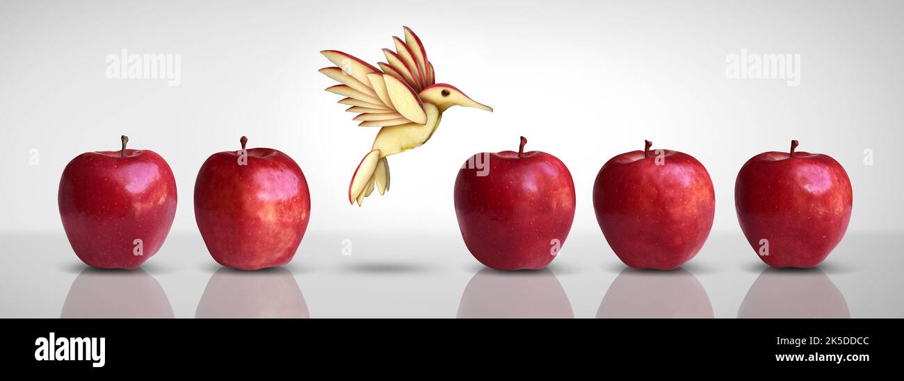 Metapher für neue Idee und kreatives Denken als Symbol für Innovation und Inspiration Konzept als Gruppe roter Äpfel mit einem anderen Apfel. Stockfoto