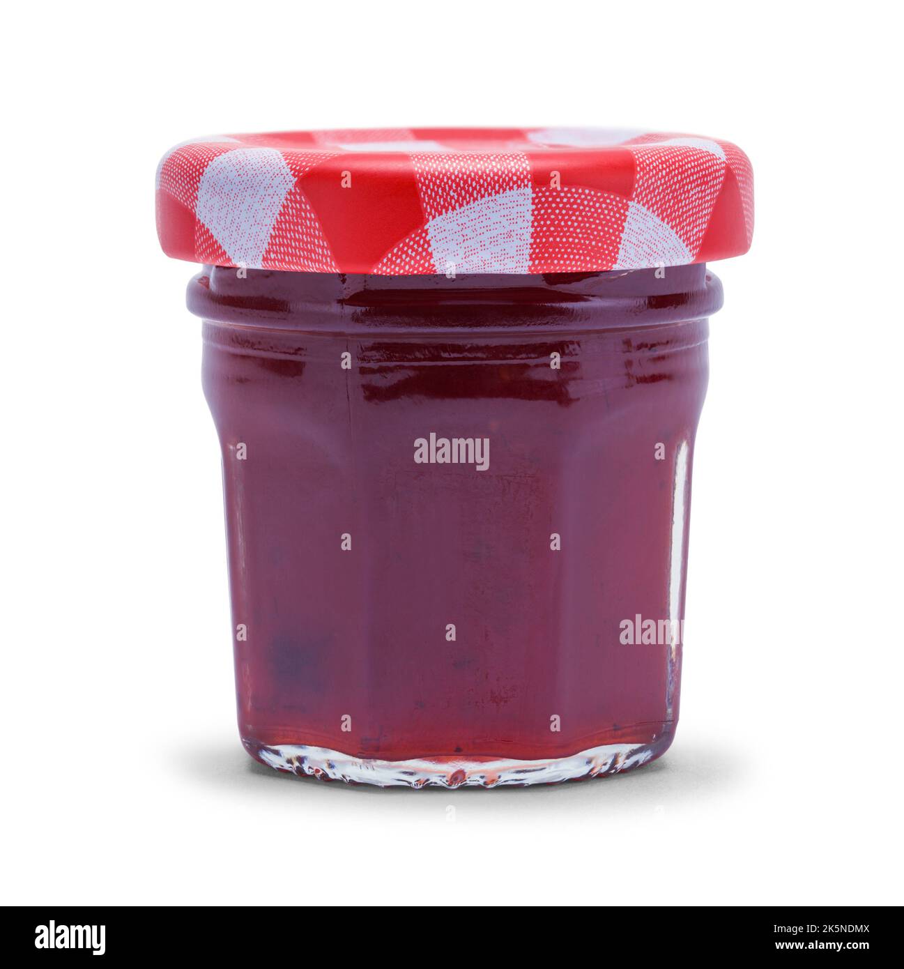 Tiny Jar of Strawberry Jam Cut Out on White. Stockfoto