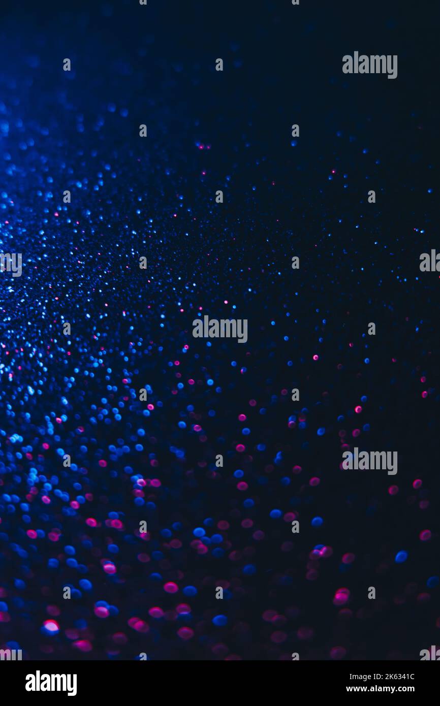 Bokeh Funken Neon Glitzer Hintergrund blau dunkel Stockfoto