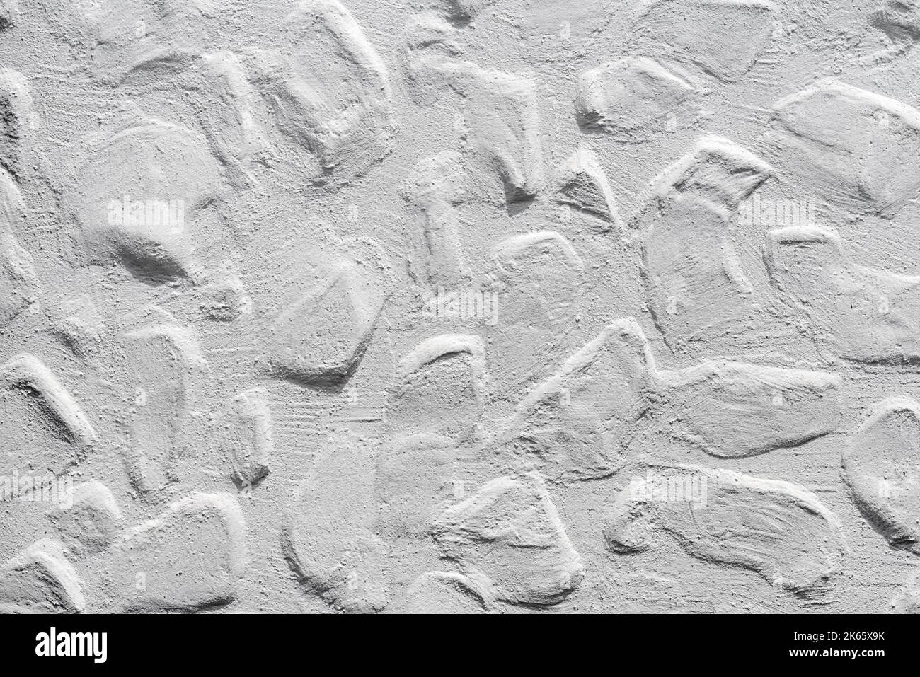 Wandstruktur aus weißem Stein als Hintergrund, raues Oberflächenmuster Stockfoto