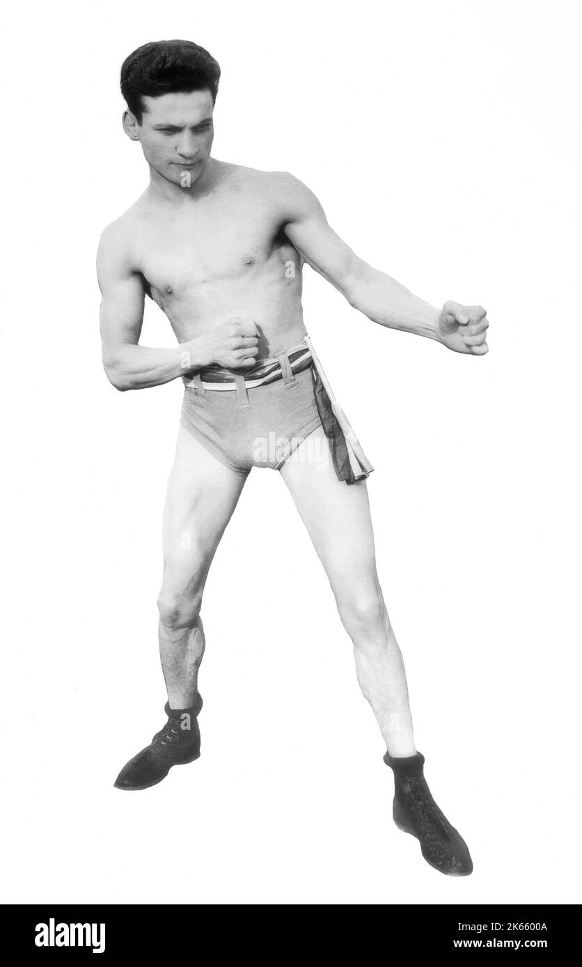 Ein Porträt von Charley White, geboren Charles Anchowitz am 25. März 1891 in Liverpool, England/ Er galt von 1906 bis 1923 als einer der besten Leichtgewicht-Boxer. Er boxte in den Vereinigten Staaten für seine gesamte Karriere und machte sein Zuhause in Chicago im Alter von sieben Jahren. Nach den aktuellen Regeln hätte er Kämpfe um Punkte für die Leichtbau-Weltmeisterschaft gewonnen, aber dann hätte er nur noch durch einen K.O.-Sieg den Titel gewinnen können. Er wurde in die Liste der 100 besten Schläger aller Zeiten des Ring Magazine aufgenommen, wahrscheinlich wegen seiner bekannten Fähigkeiten mit dem linken Haken. Stockfoto