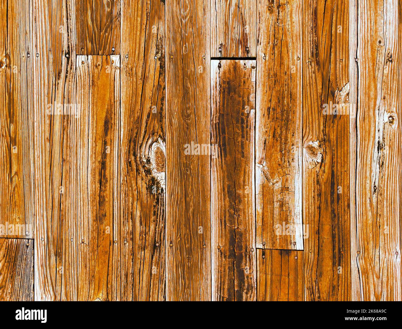 Ein Zaun vintage natürliche Holz Wand Ranch Bauernhof Scheune Tür Closeup Holzmaserung Grenze Pferd stabil Boden Brett Hintergrund Landwirtschaft Ranch Garten fen Stockfoto