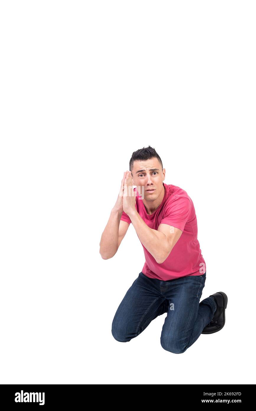 Verzweifelter Mann kniete und flehte mit Gebetshänden Stockfoto Verzweifelter Mann kniete und flehte mit Gebetshänden Stockfoto