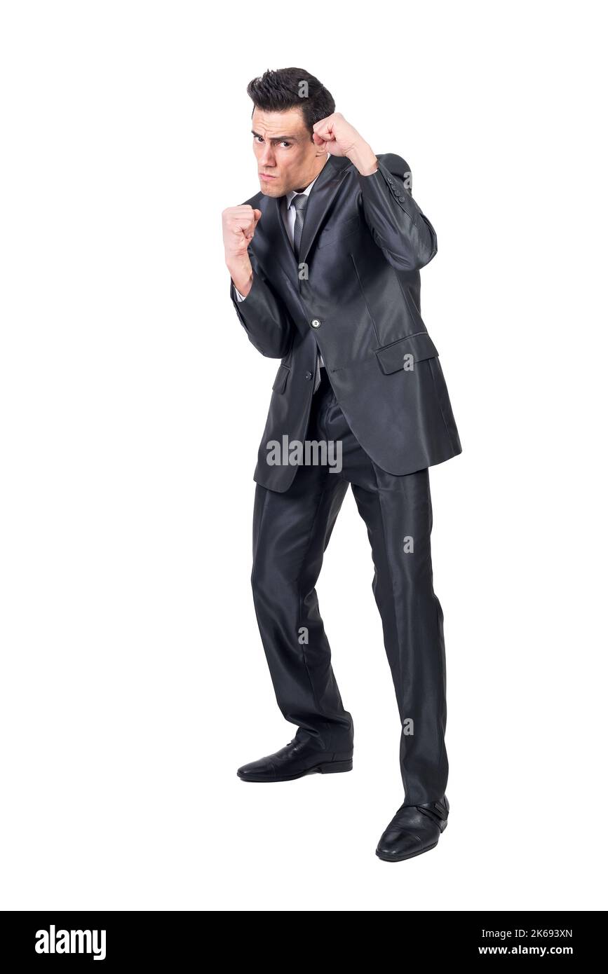 Geschäftsmann im Anzug, der in Kampfhaltung steht Stockfoto