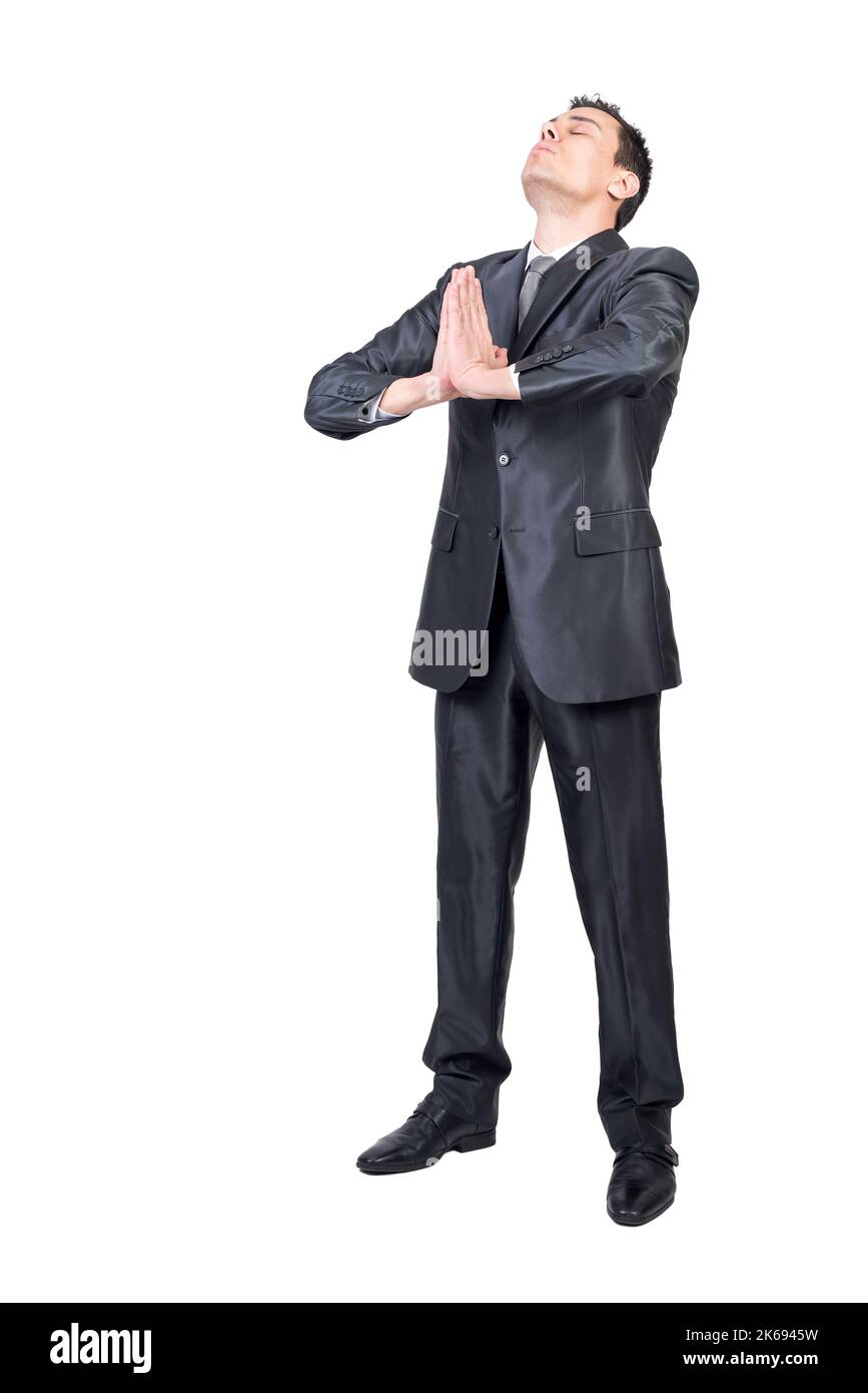 Ruhiger Geschäftsmann meditiert auf weißem Hintergrund. Weißer Hintergrund. Stockfoto