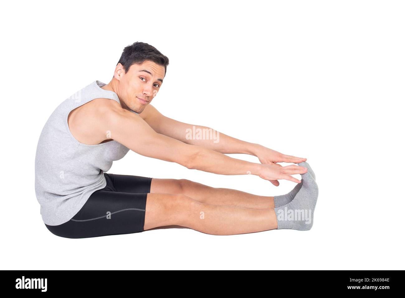 Inhalt sportlicher Mann in Sportswear Stretching Hamstring Stockfoto