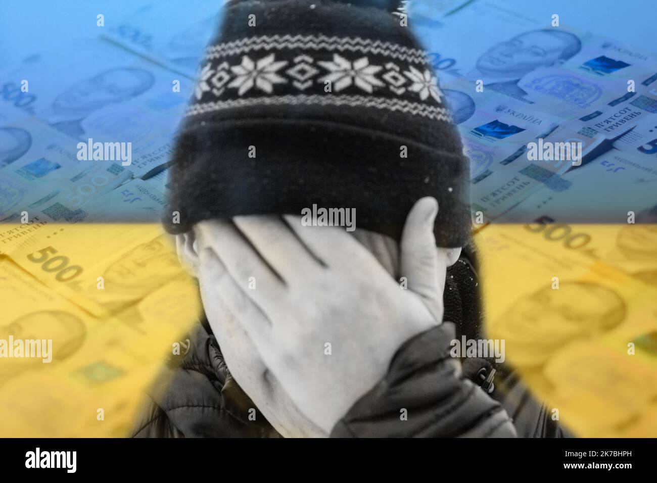 Unschärfe-Mann versteckt Gesicht. Flagge Ukraine. Erhöhung der Kosten für die Gasrechnung. Steigende Energiepreise. Finanzkrise. Sparsamkeit von Gas. Energiekrise in Europa Stockfoto