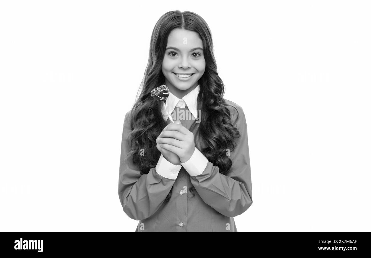 Kindheit. Jugendlich Zahnpflege. Süßer Zahn. Lecker. Mädchen auf weiß isoliert. Stockfoto