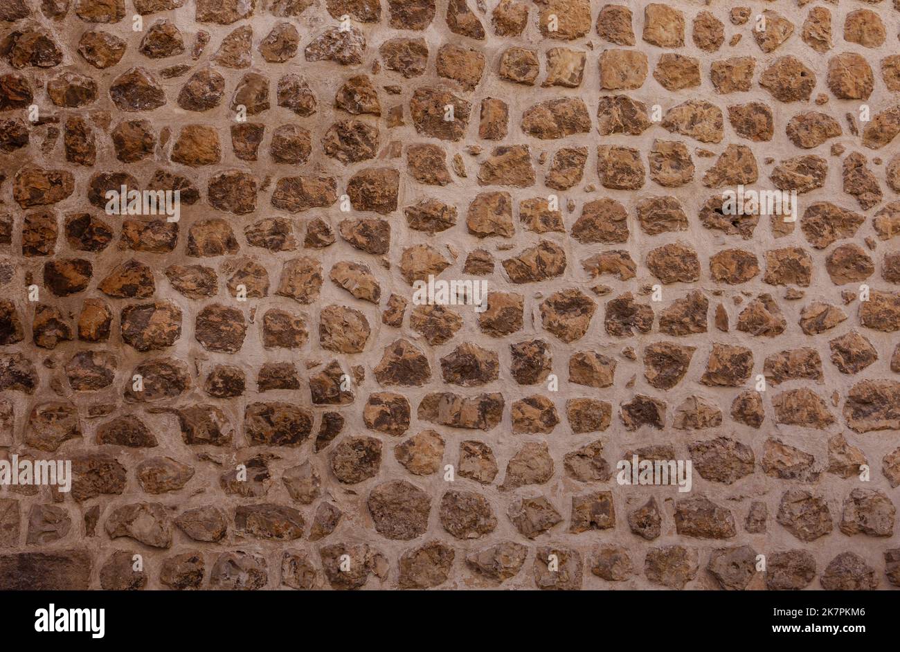 Eine alte Steinmauer Hintergrund. Stockfoto