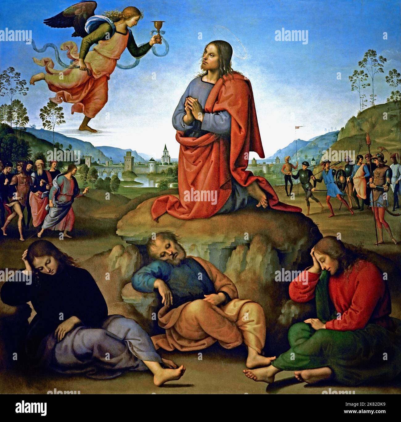 Er Agonie im Garten 1492 Pietro Perugino 1446/1452 – 1523 geboren Pietro Vannucci, italienischer Renaissance-Maler der umbrischen Schule, Italien (Christus wird in der Mitte der Tafel über einem klaren Himmel dargestellt, kniet im Garten Gethsemane und empfängt von einem Engel einen göttlichen Kelch. Seine Figur bildet ein Dreieck mit den drei schlafenden Aposteln unten (von links: Johannes, Petrus und Jakobus); das Dreieck ist durch die symmetrische Linie der Hügel mit den Seiten des Gemäldes verbunden. Hinter Jesus liegt eine Seenlandschaft, ein typisches Element der damaligen italienischen Malerei, mit einer befestigten Stadt. Stockfoto
