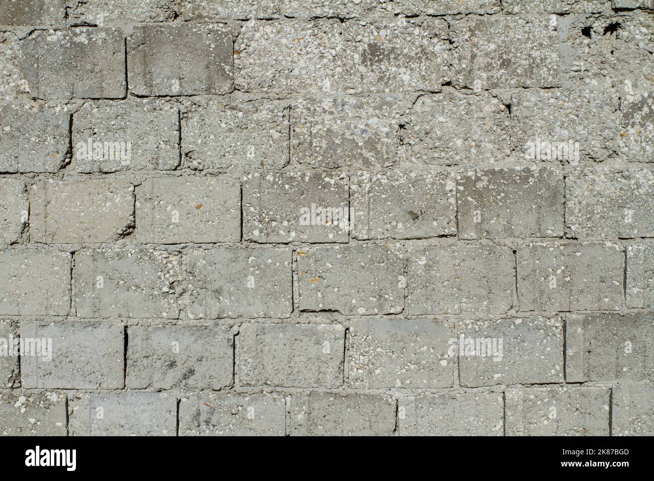 Betonwand Hintergrund Nahaufnahme ( Muster der grauen Wand aus Betonsteinen ) Stockfoto