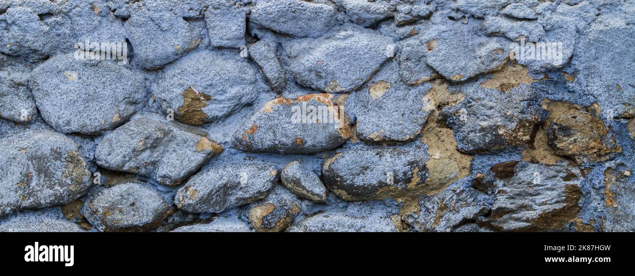 Alte grau gestrichene Steinwand Hintergrund Stockfoto
