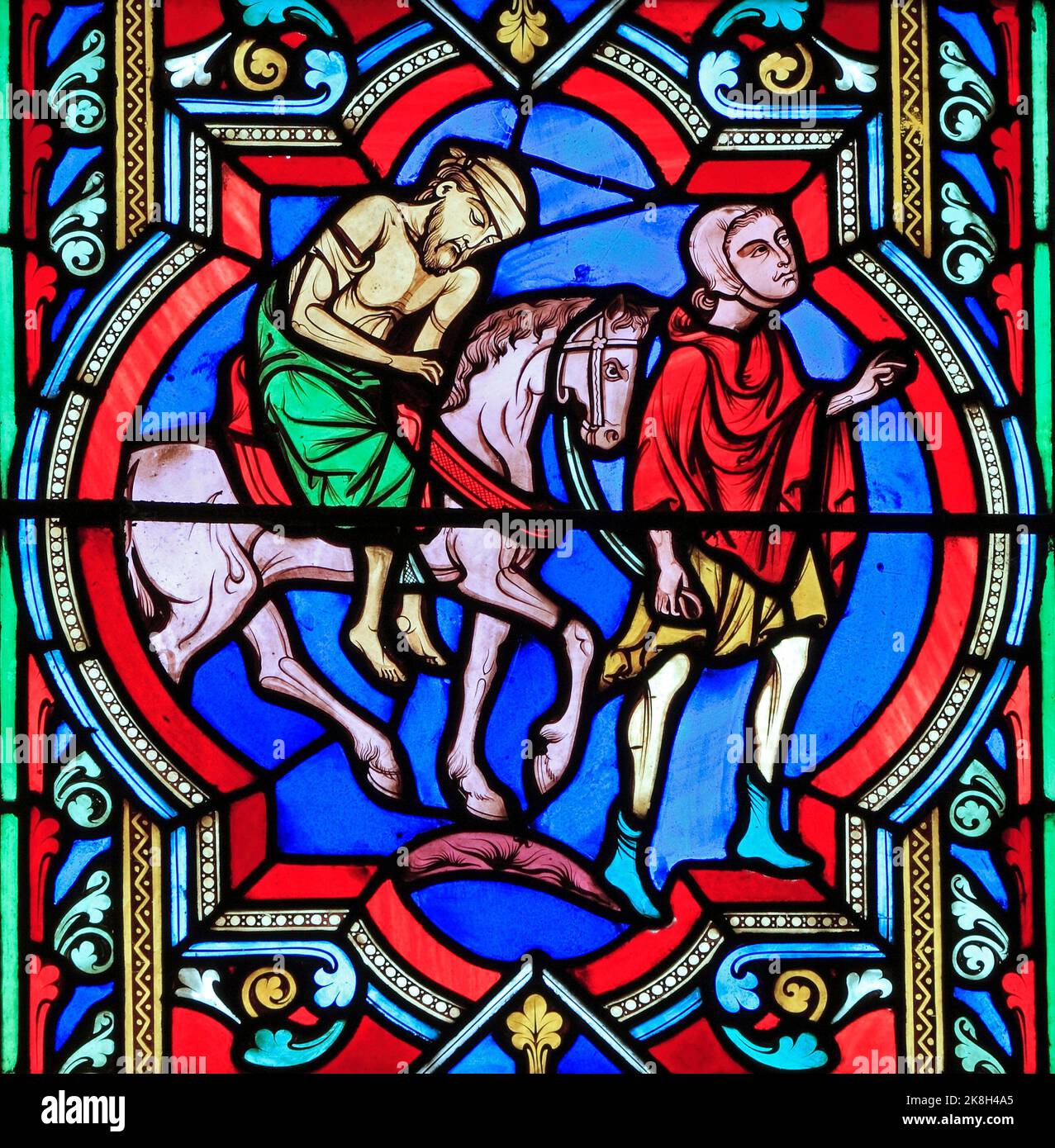 Das barmherzige Samariter-Gleichnis, Samariter trägt den verletzten Reisenden auf seinem Pferd, Glasfenster, von Oudinot aus Paris, 1859, Feltwell, Norfolk Stockfoto