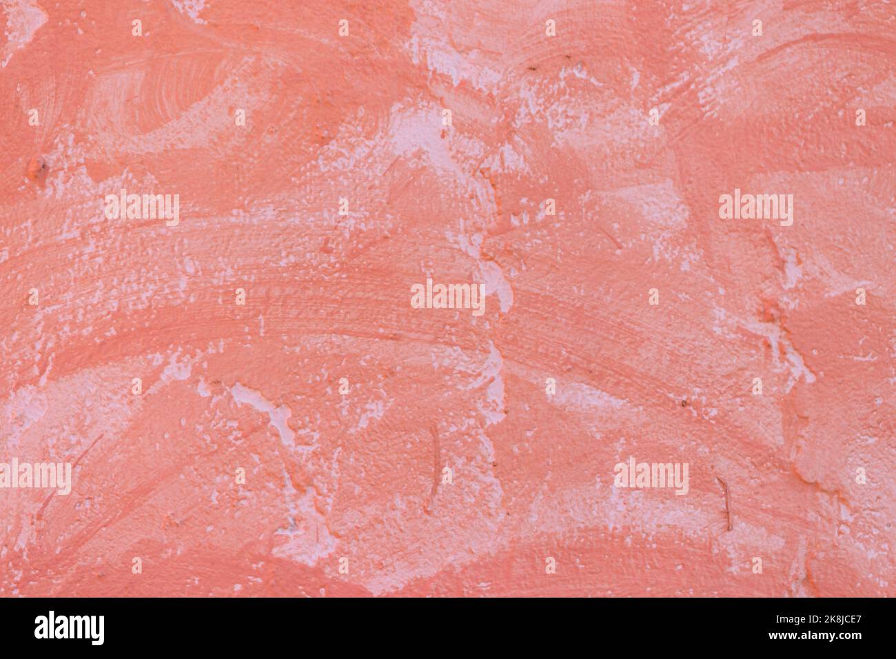 Orangefarbenes Beton- oder Zementmaterial in abstrakter Wandhintergrundstruktur. Stockfoto