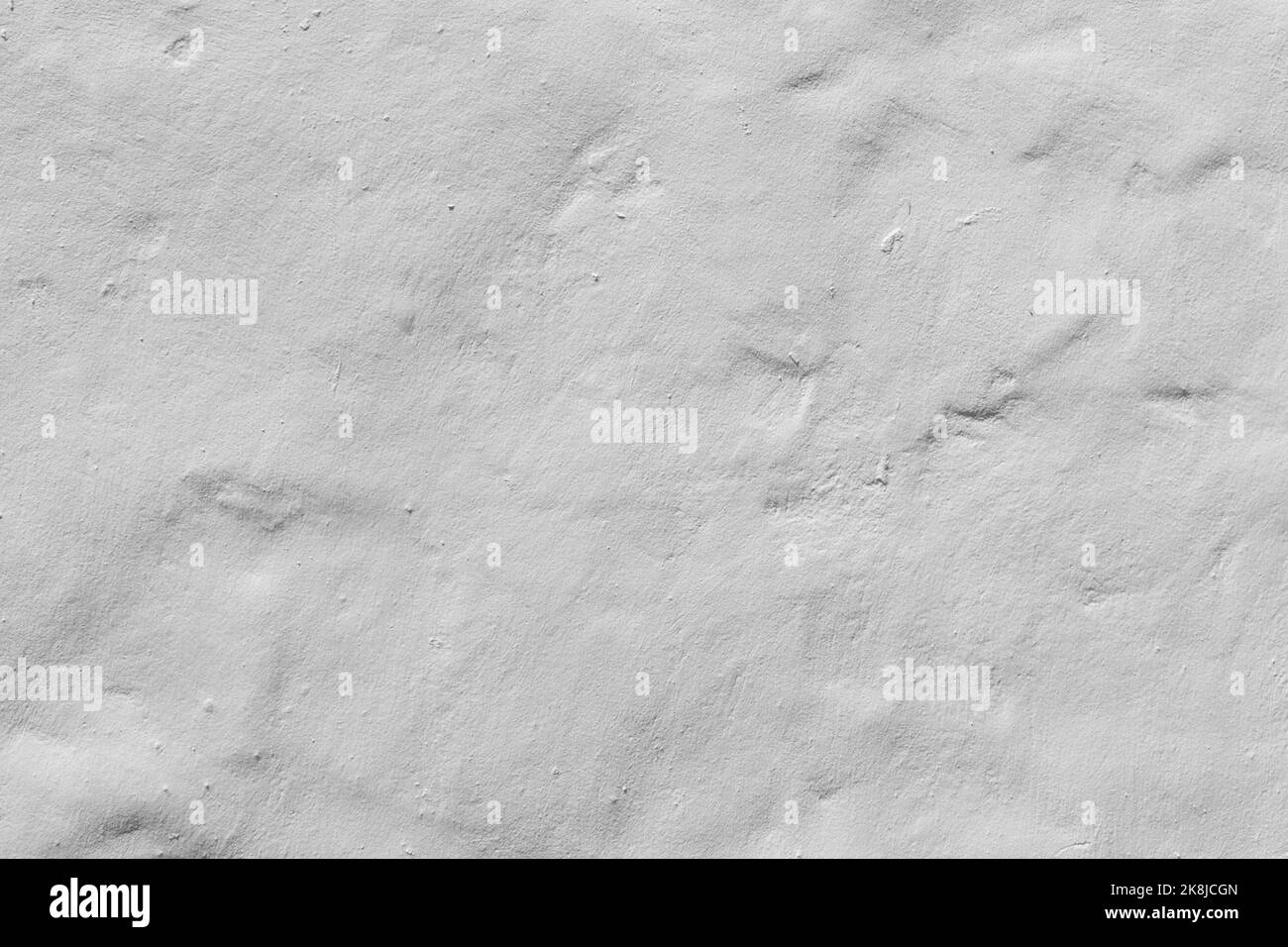Weißer Beton oder Zementmaterial in abstrakter Wandhintergrundstruktur. Stockfoto