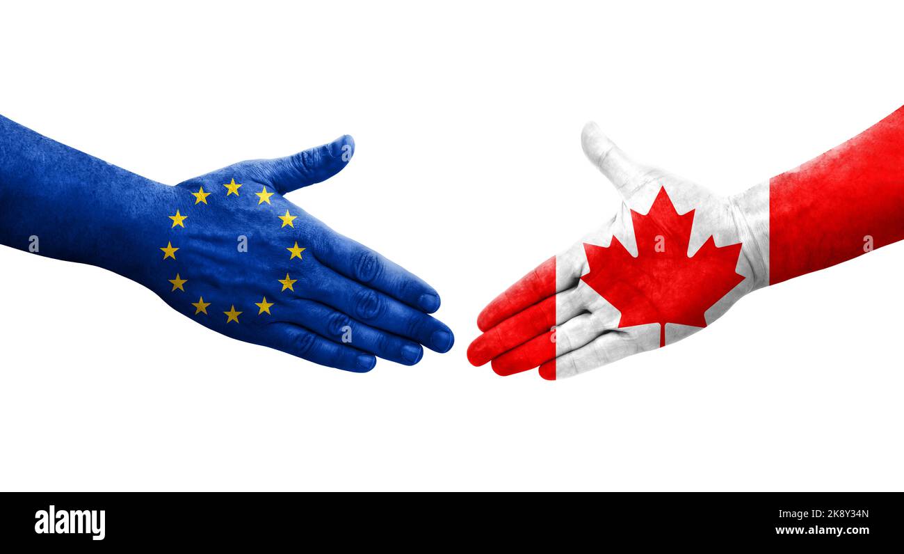 Handschlag zwischen Flaggen von Kanada und der Europäischen Union auf Händen gemalt, isoliertes transparentes Bild. Stockfoto