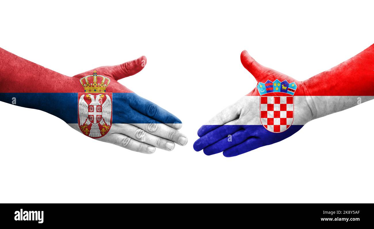 Handschlag zwischen Kroatien und Serbien Flaggen auf Händen gemalt, isolierte transparente Bild. Stockfoto