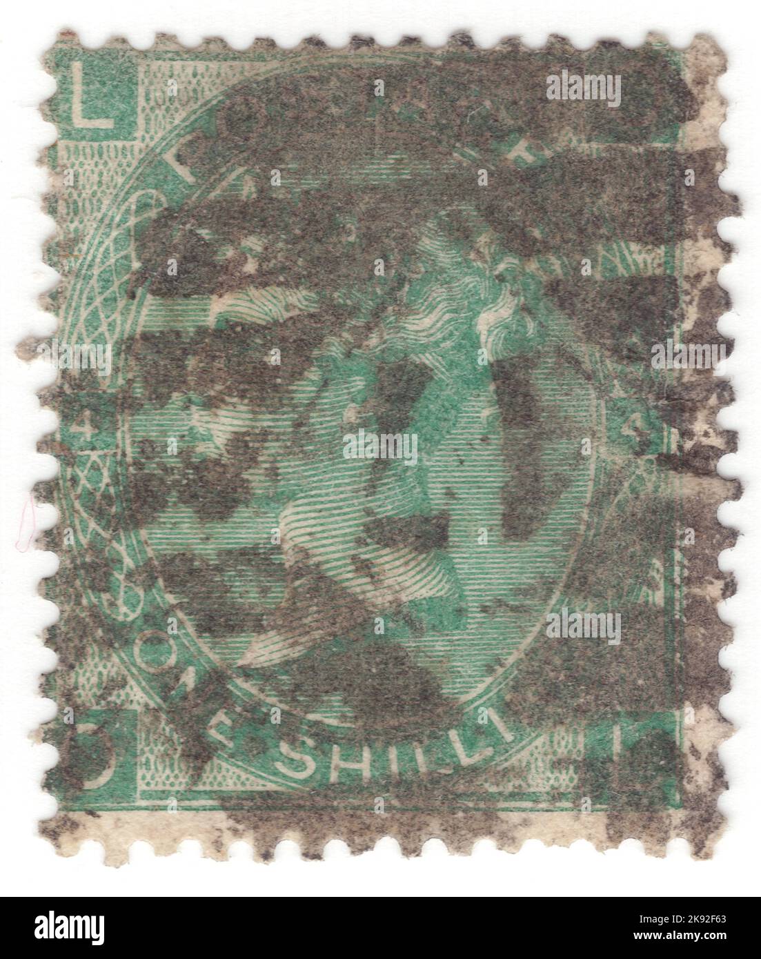 VEREINIGTES KÖNIGREICH - 1865: Eine 1 Schilling grüne Briefmarke, die das Porträt von Königin Victoria zeigt. Platte 4 Stockfoto