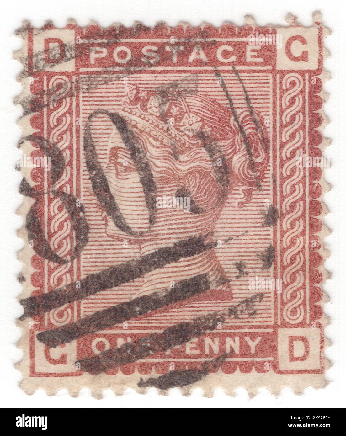 VEREINIGTES KÖNIGREICH - 1880: Eine rot-braune Briefmarke mit 1 Pence, die das Porträt von Königin Victoria zeigt Stockfoto