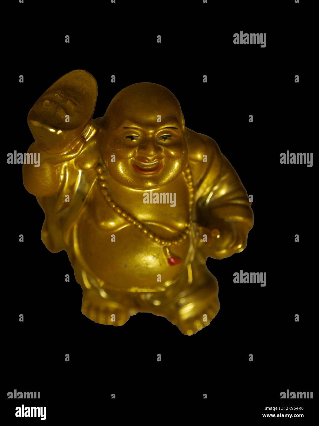 Lachendes Buddha-Idol auf schwarzem Grund. Stockfoto