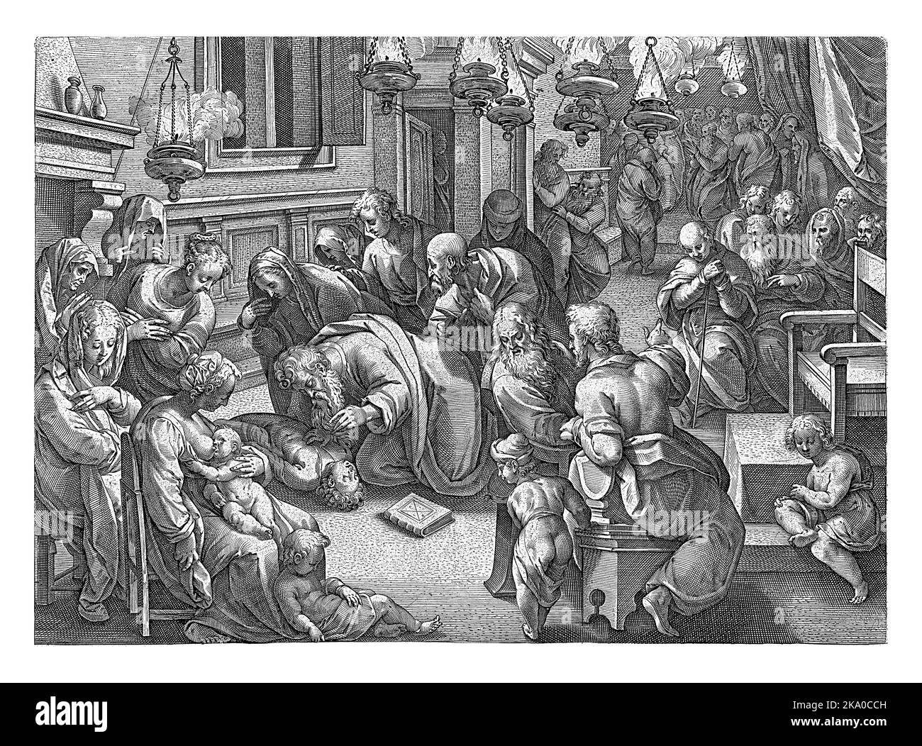 In einem Raum voller Menschen, angezündet mit Öllampen, kniet Paul neben einem Jungen, der auf seinem Rücken auf dem Boden liegt. Stockfoto