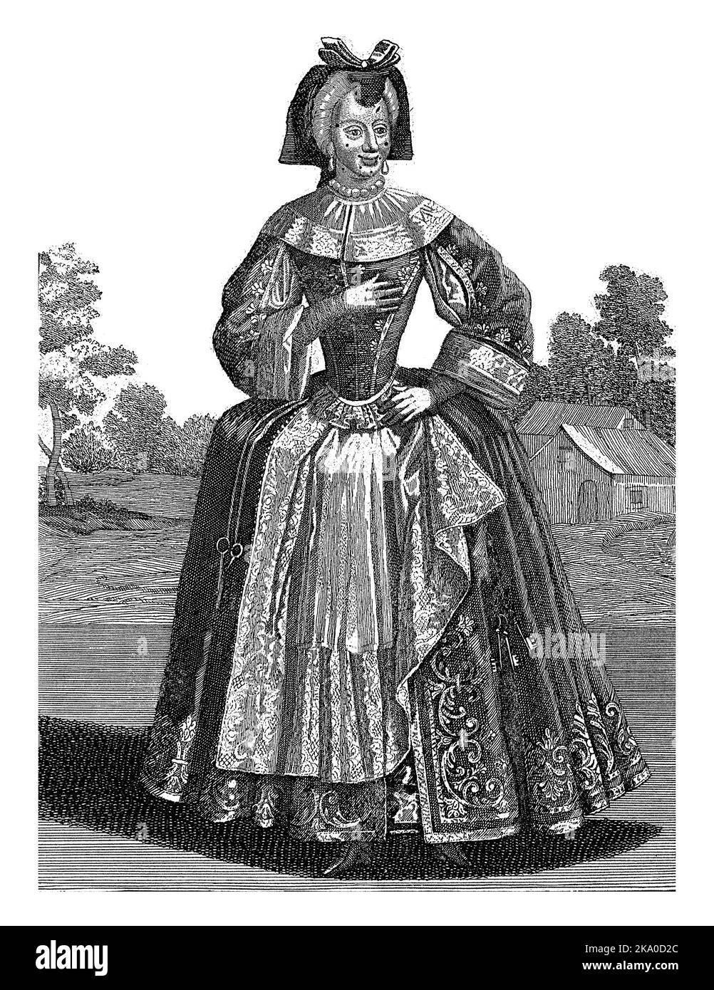 Eine weibliche Figur mit einer Schere und einem Schlüsselbund am Gürtel. Stockfoto