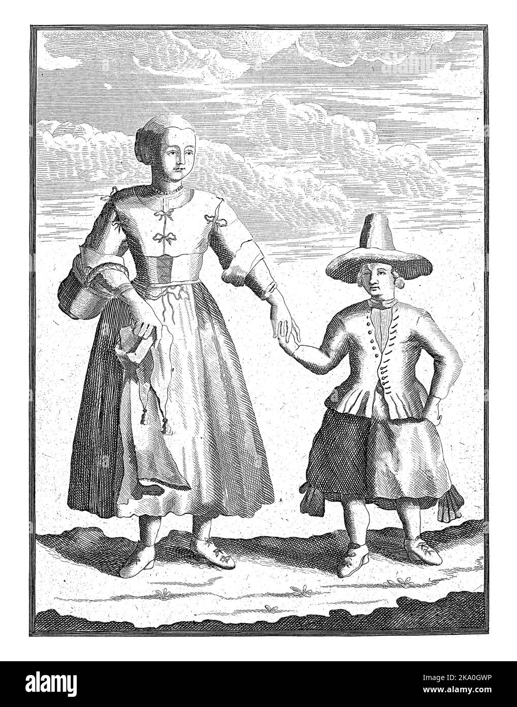 Eine Bäuerin aus Groningen mit ihrem Sohn. Die Frau trägt eine Weste mit Schleifen und einer weißen Mütze auf dem Kopf, der Junge trägt einen großen Hut und ein b Stockfoto