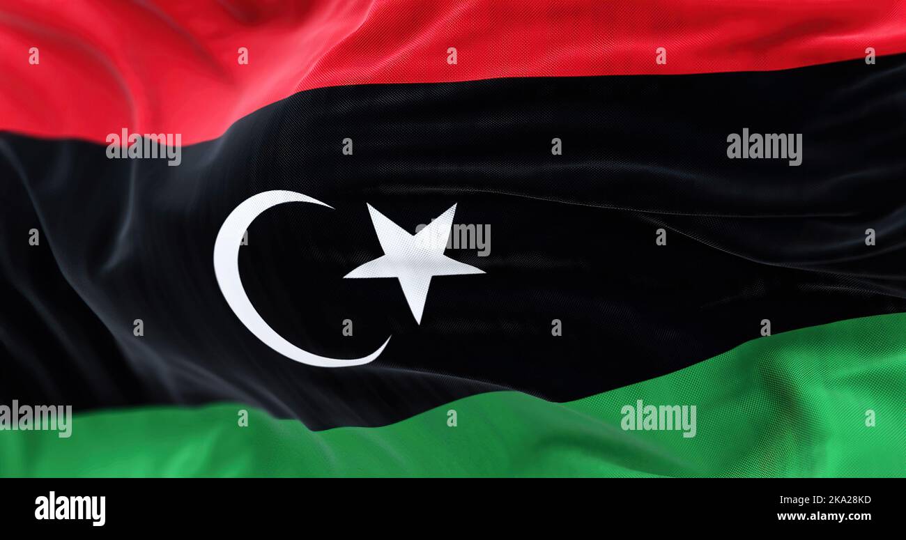 Nahaufnahme des Wagens der Nationalflagge Libyens. Der Staat Libyen ist ein Staat Nordafrikas. Texturierter Hintergrund aus Stoff. Selektiver Fokus Stockfoto