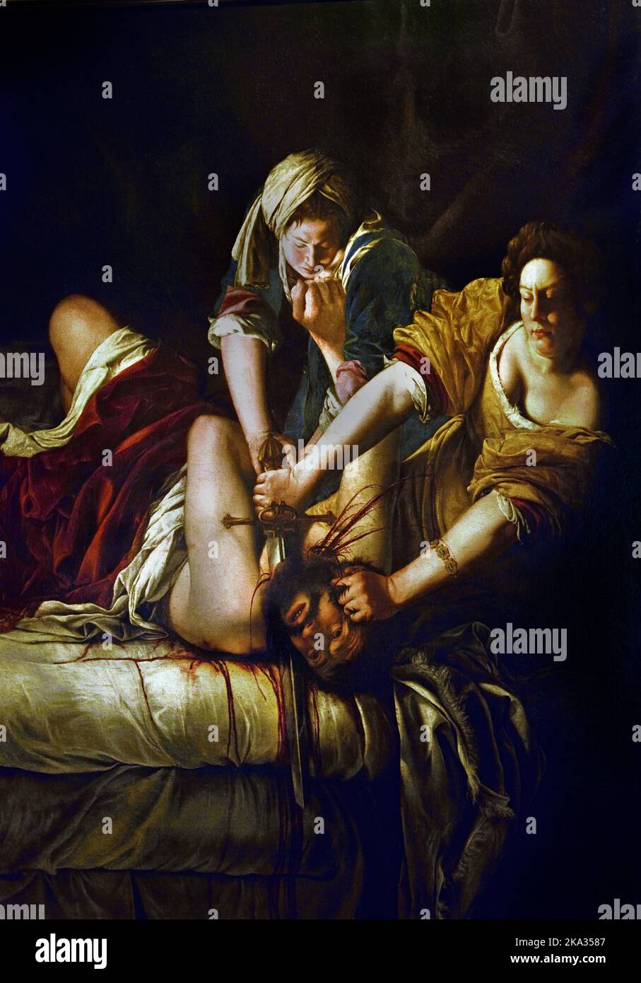 Judith, Beheading Holofernes, Artemisia Gentileschi, (Rom 1593 - Neapel 1652/53) , Florenz, Italien. (Bevor sich die Israeliten Holofernes unterwerfen, treten Judith und ihr Sklave in die Basis der Assyrer ein und treffen den Befehlshaber. Judith wird Holofernes betrunken, lässt ihn verschlafen, nimmt sein Schwert, greift Holofernes Kopf an seine Haare und betet zu ihrem gott, um ihre Kraft zu geben. Dann, in zwei Schlägen, schneidet sie ihm den Kopf ab, Stockfoto