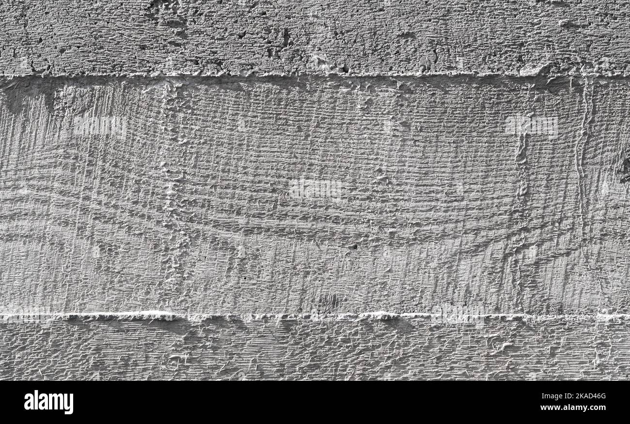 Struktur der grauen Betonwand mit Aufdruck Relief von Holzschalung, Hintergrundbild Stockfoto