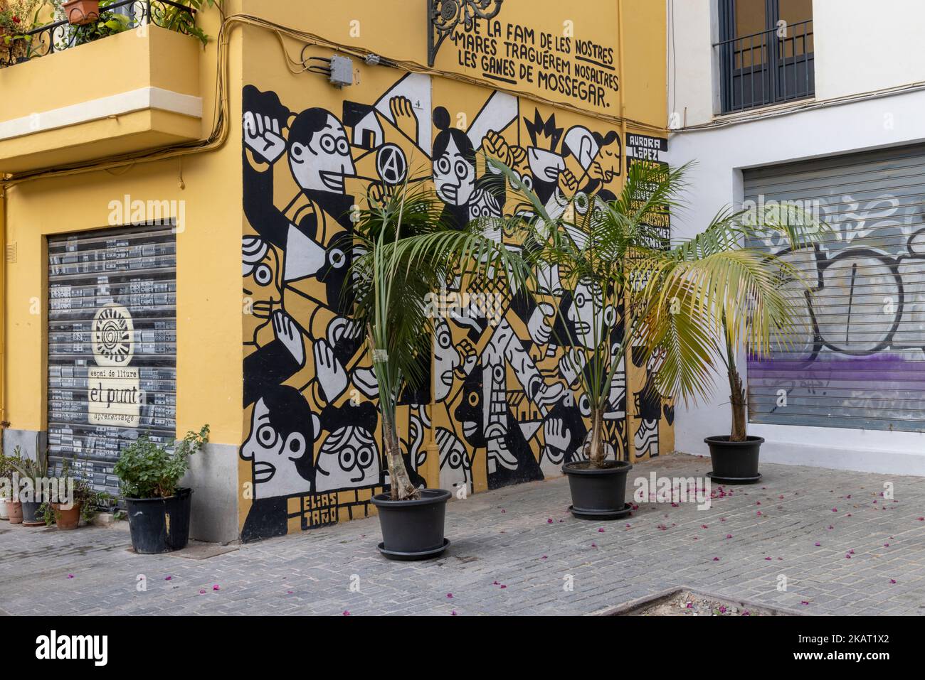 "Vom Hunger unserer Mütter werden wir den Wunsch zu essen schlucken", Graffiti an der Wand von El Punt (Bibliothek), Carrer de Garcilaso, Valencia, Spanien Stockfoto
