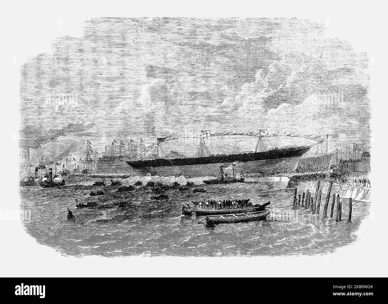 Der Start des Knight Commander 1864, des ersten Schiffes, das seit der ersten Öffnung der Tore im Februar 1860 im Gravierdock des Dublin Port gestartet wurde. Menschen versammelten sich an jeder möglichen Stelle, die einen Blick auf das Ereignis bot, und auf dem Fluss Liffey drängten zahlreiche Boote, darunter ein Dampfschlepper, das Flusswasser gegenüber des Schlupfes. Die Marchioness von Kildare war die Patenschaft des neuen Schiffes und brach die übliche Champagnerflasche auf ihrem Rumpf. Stockfoto