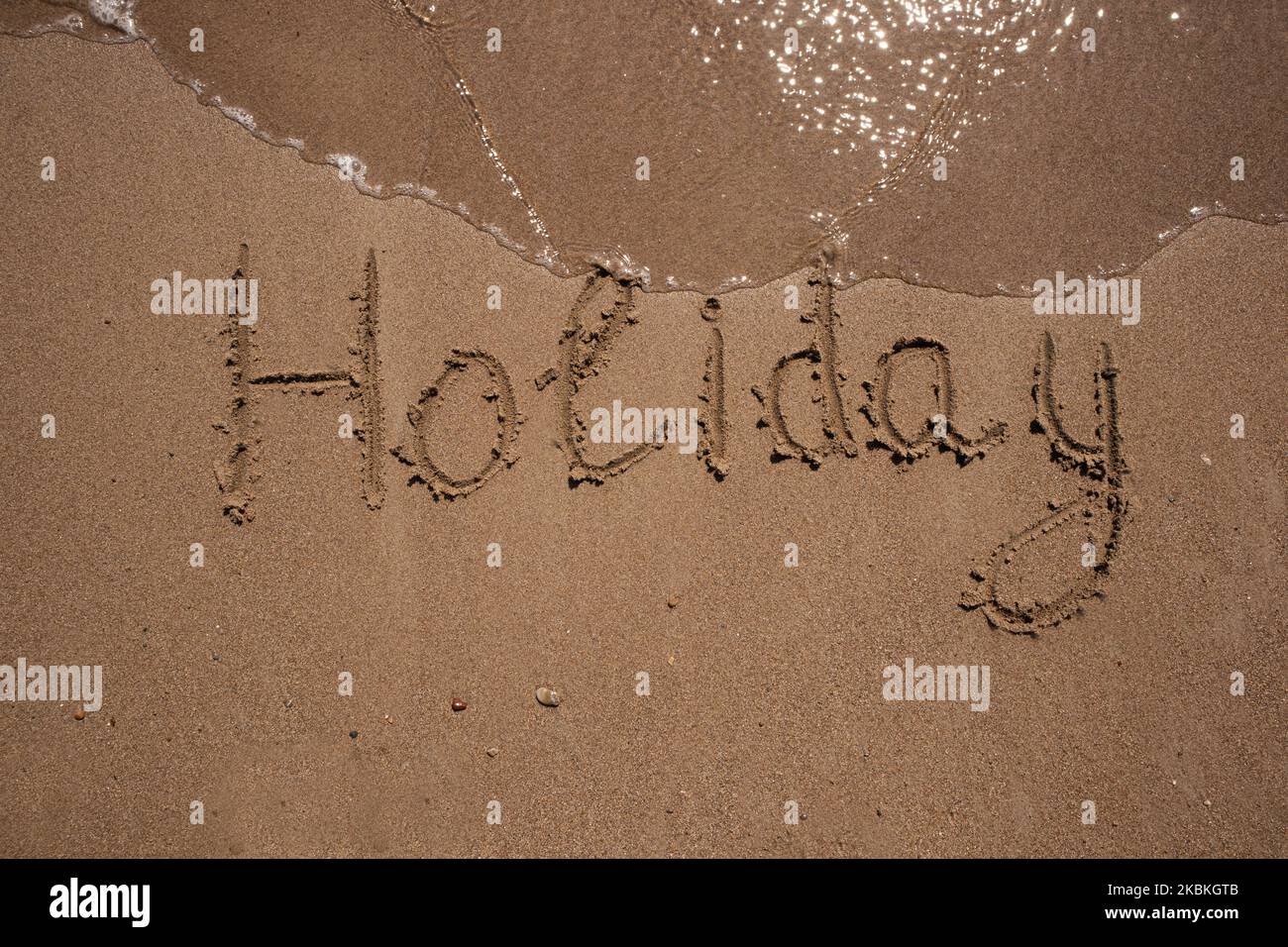 Die Inschrift Urlaub auf dem Sand, am Meer und der Welle, kopieren Raum Stockfoto