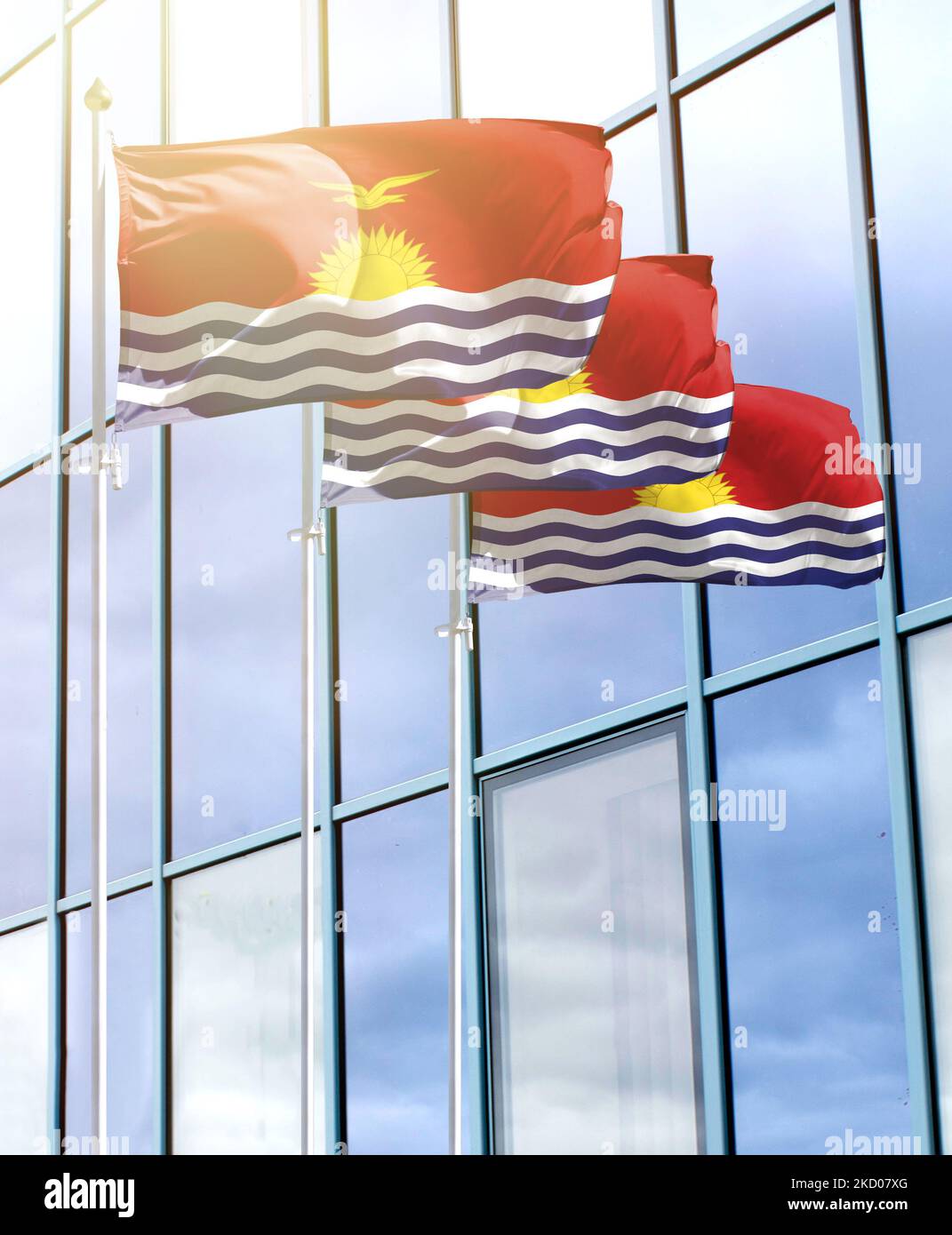 Fahnenmasten mit der Flagge von Kiribati vor dem Business Center Stockfoto