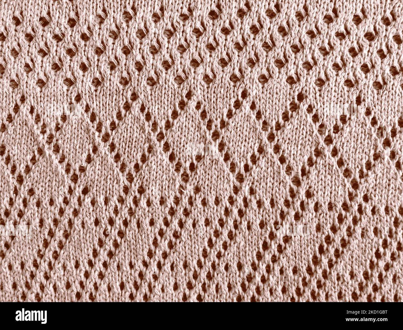 Strickstoff Mit Beiger Textur. Warmes Wollmuster. Strickmode Detail Hintergrund. Gewebte Stoffe. Skandinavisches Makro-Hintergrundbild. Faden Aus Organischer Baumwolle. Abstrak Stockfoto