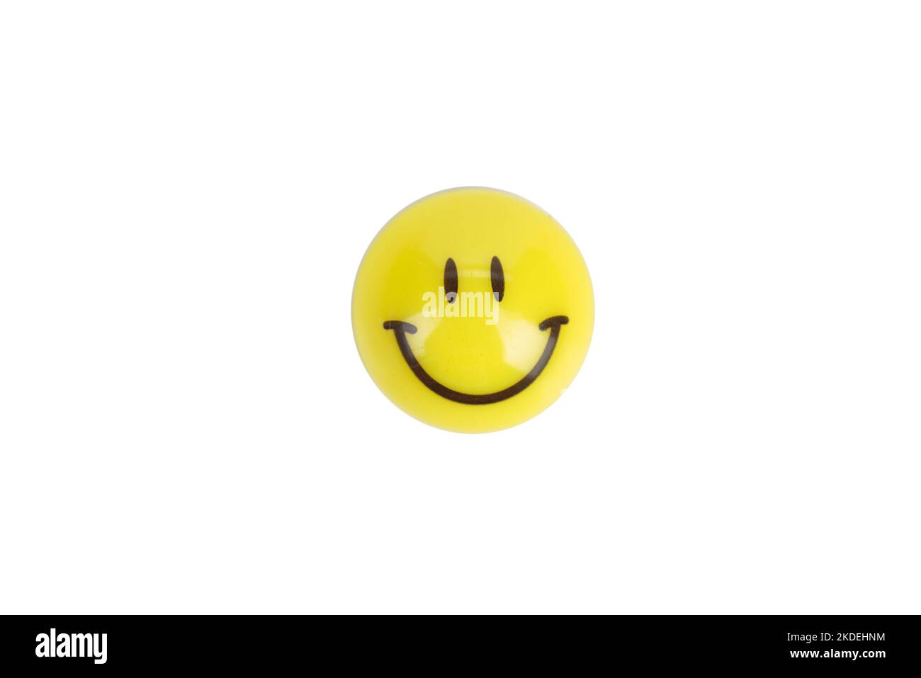 Eine Ikone in Form eines lächelnden Smiley-Gesichts. Isoliert auf weißem Hintergrund. Nahaufnahme. Stockfoto