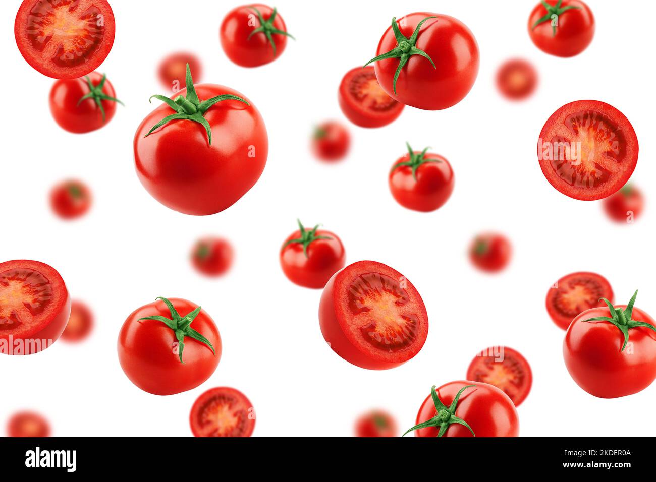 Fallende Tomate isoliert auf weißem Hintergrund, selektiver Fokus Stockfoto