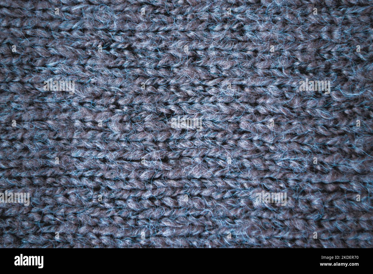 Handgemachte Strickstruktur mit Makrofäden. Stockfoto