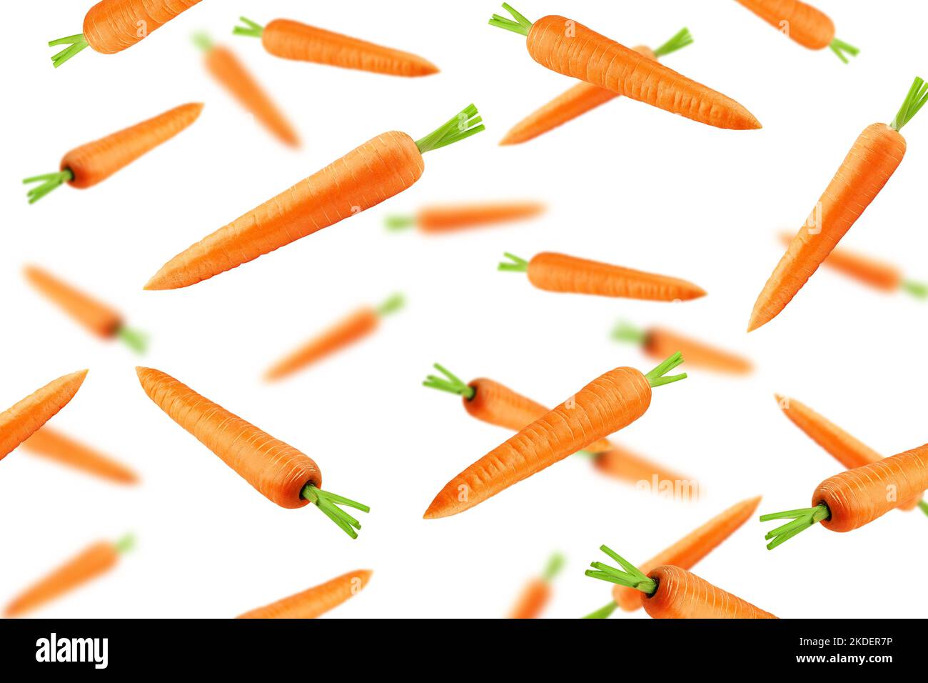 Fallende Karotte isoliert auf weißem Hintergrund, selektiver Fokus Stockfoto