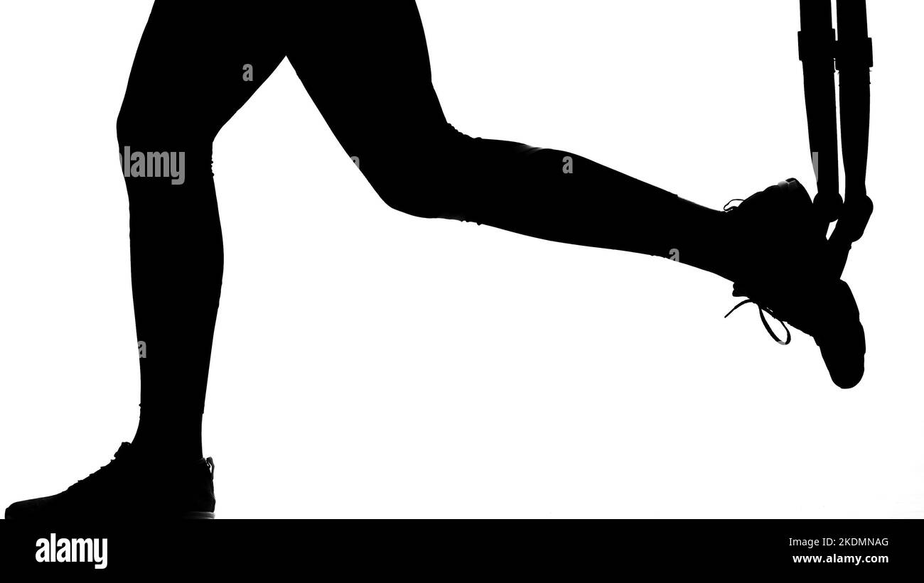 Auf einem weißen Hintergrund, einem Schatten, einem schwarzen Umriss einer weiblichen Figur, die Übungen macht. Hochwertige Fotos Stockfoto