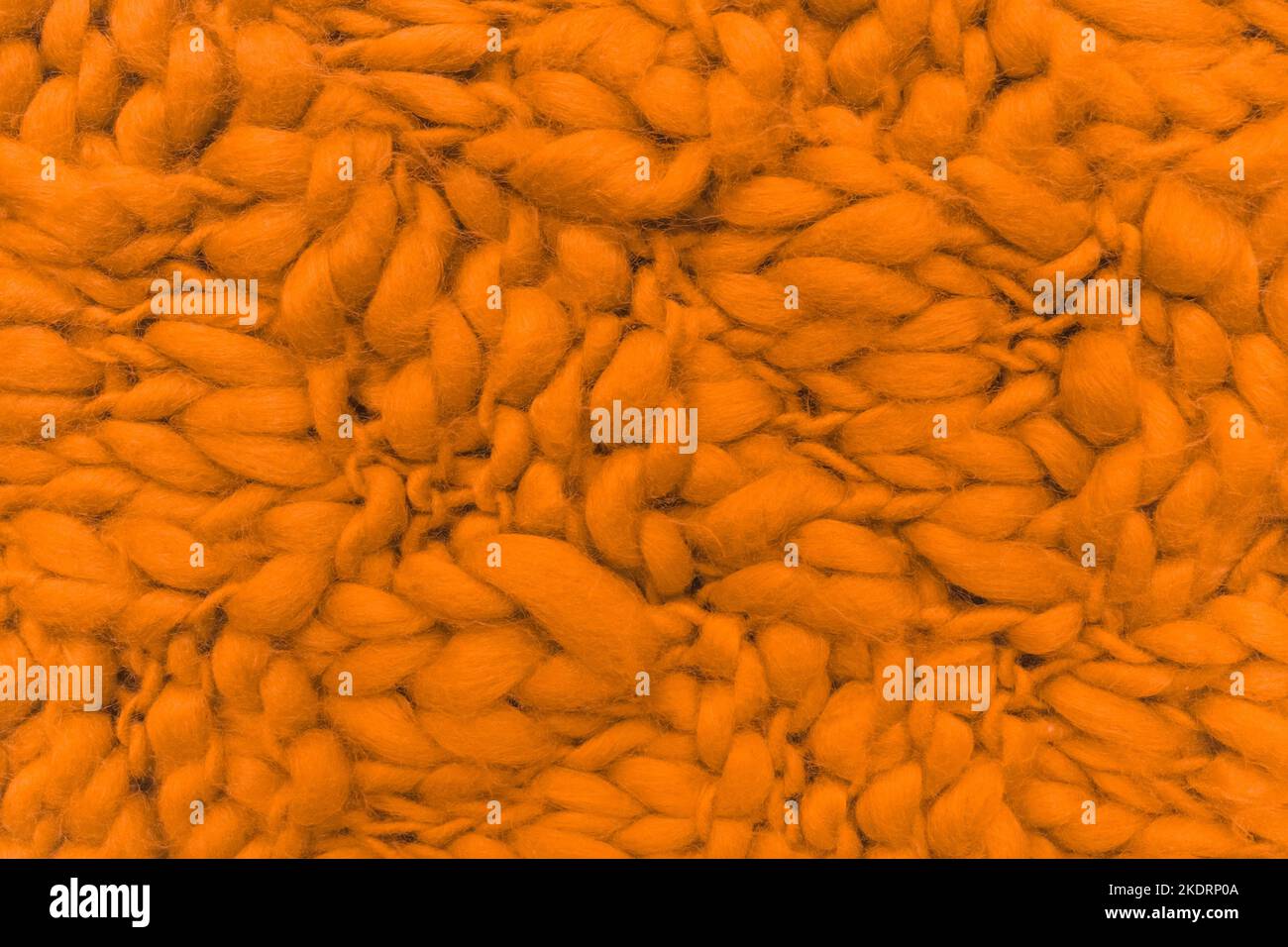 Stoff Faden Geflecht Textur orange Strickmuster Faser Material Hintergrund Textil gewebt. Stockfoto