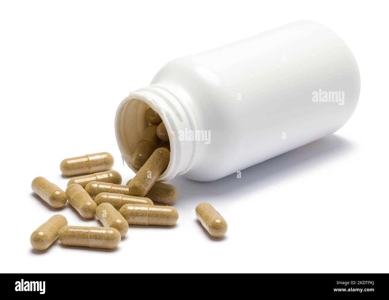 Flasche verschütteter Pillen auf Weiß geschnitten. Stockfoto
