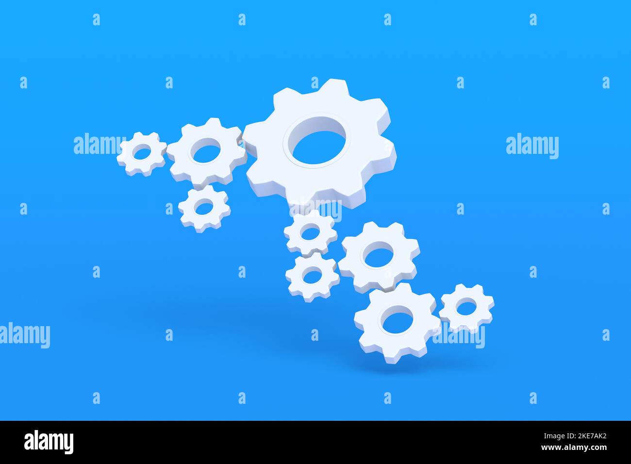 Zahnradsatz auf blauem Hintergrund. Engineering-Technologie. Entwicklung von Mechanismen. Industrieller Fortschritt. Ideenkonzept. Geschäftliche Zusammenarbeit. Teamarbeit und Stockfoto