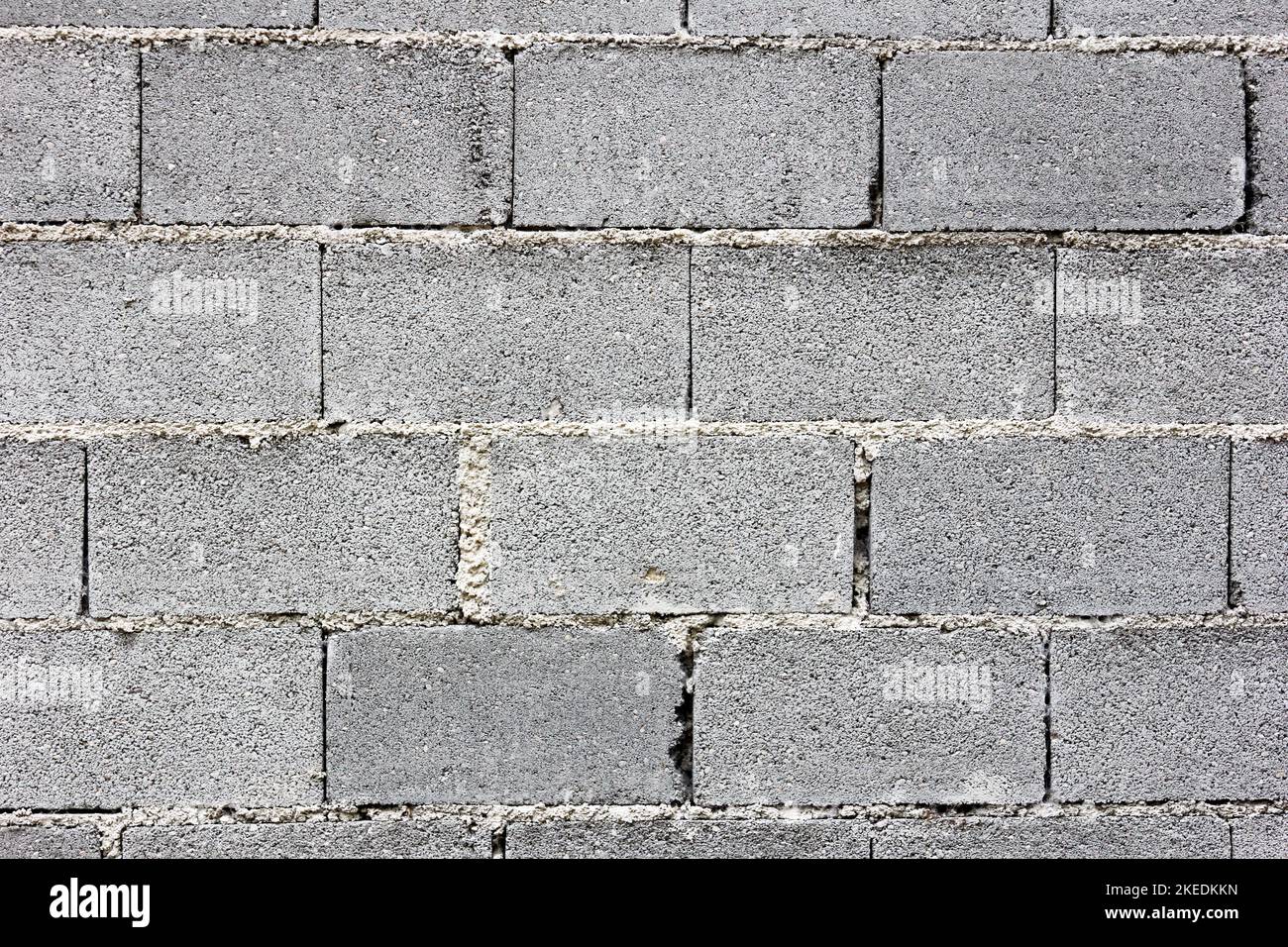 Eine Wand aus Betonsteinen – eine Oberflächenstruktur Stockfoto