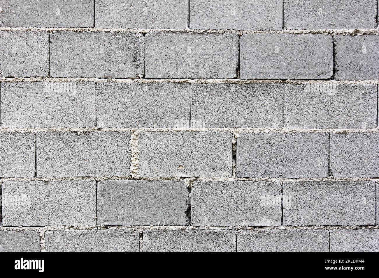 Eine Wand aus Betonsteinen – eine Oberflächenstruktur Stockfoto