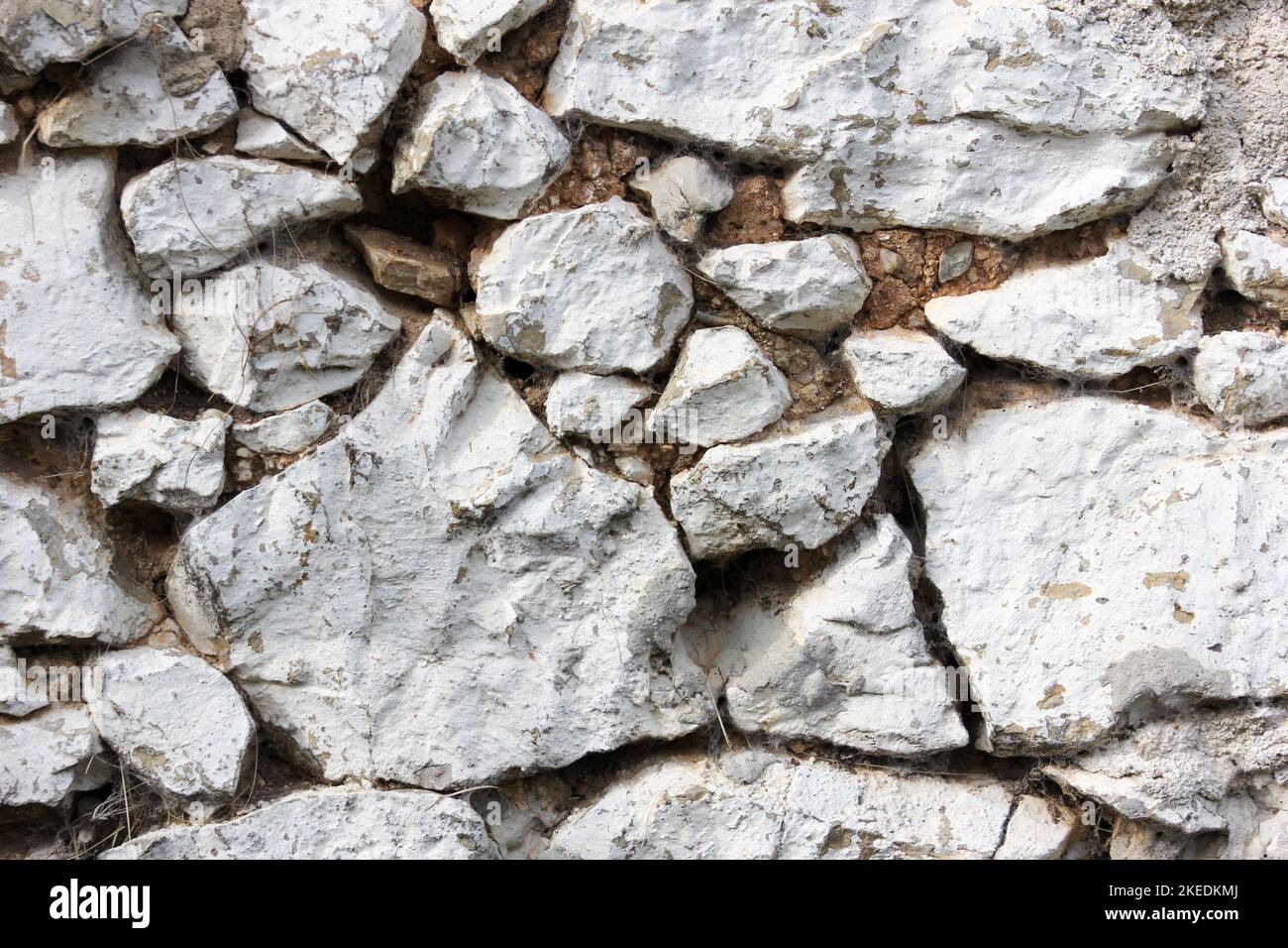 Eine Wand aus Steinen – eine Oberflächenstruktur Stockfoto